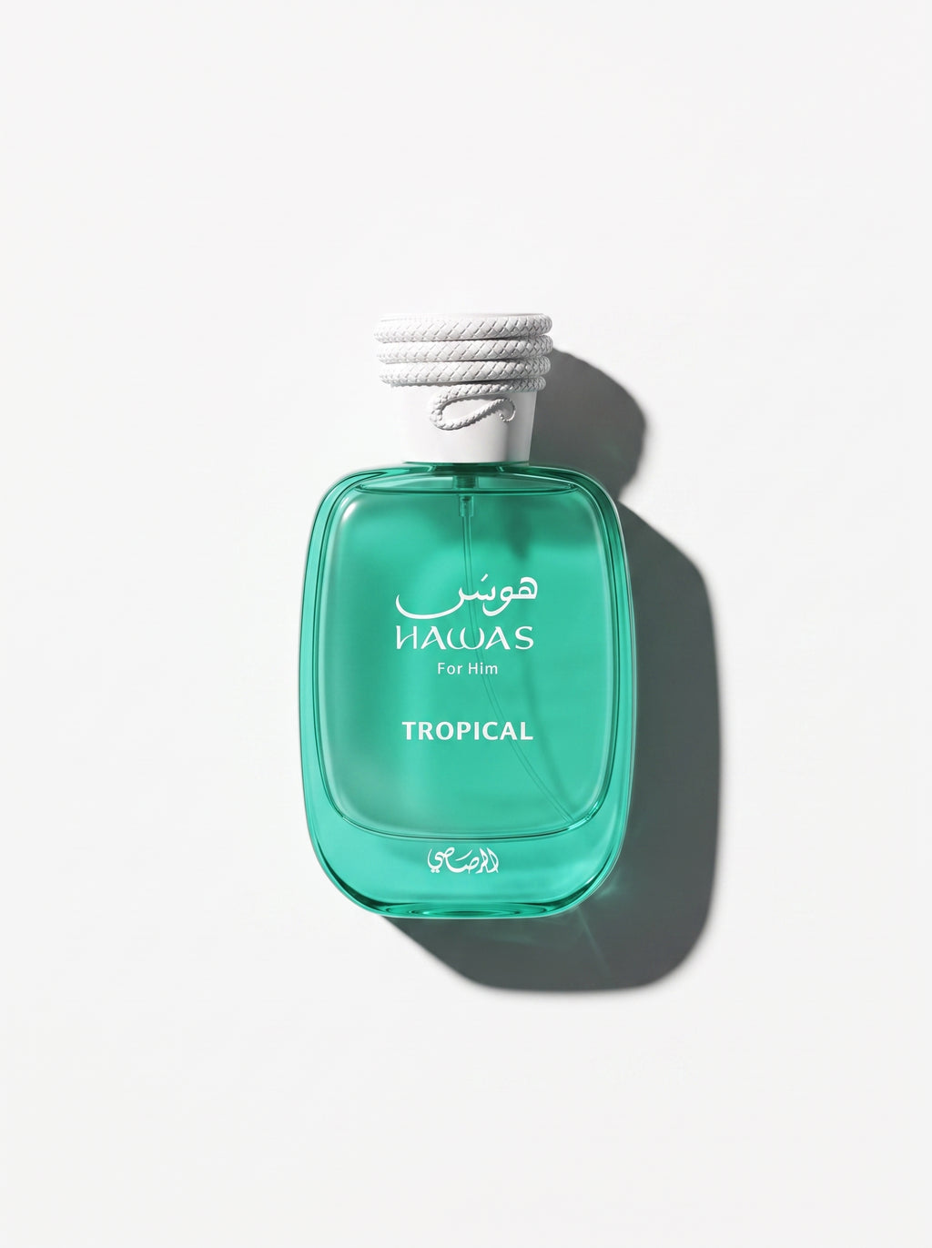 Hawas Tropical — emerald green glass bottle with a white rope-textured cap, shot top-down