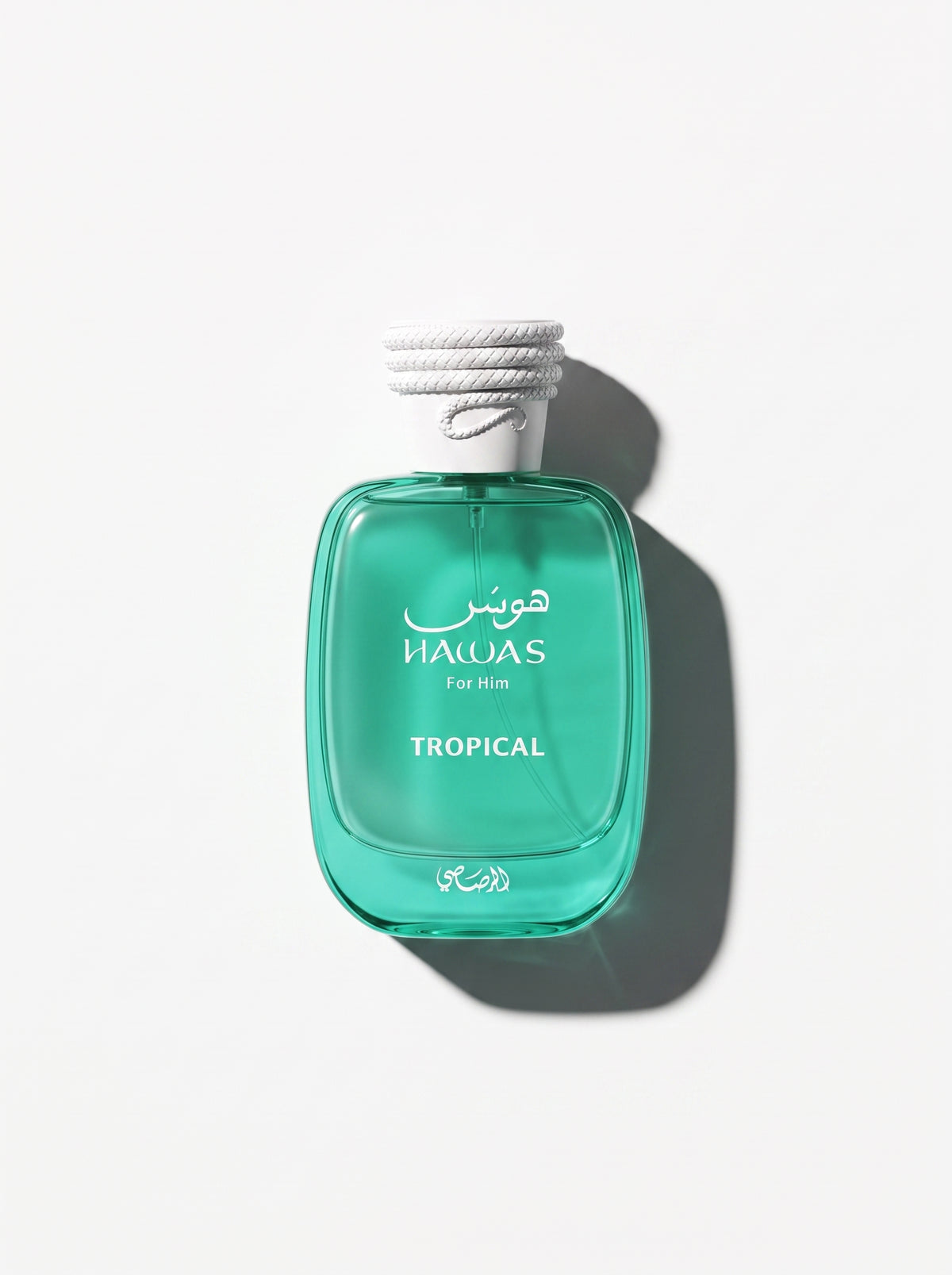 Hawas Tropical — emerald green glass bottle with a white rope-textured cap, shot top-down
