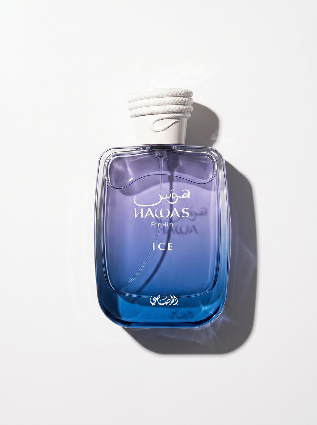 Hawas Ice — blue-to-violet gradient bottle with a white rope-textured cap, shot top-down