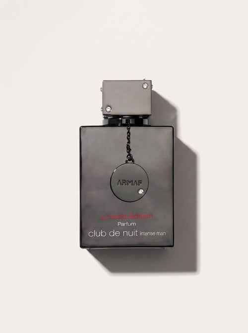 Club De Nuit Intense Man Limited Edition Parfum — black bottle, chained ARMAF medallion, red Arabic script, top-down